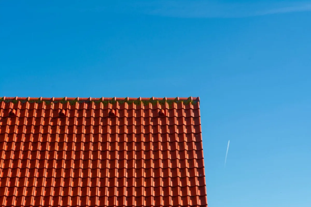 Tile roof gable in full sun, the kind of exposure that sets roof life in New Rochelle, NY